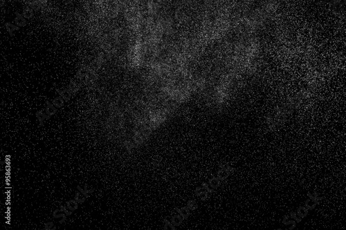 abstract splashes of water on a black background. splashes of milk. abstract spray of water. abstract rain. shower water drops. white dust explosion. abstract texture. abstract black background..
