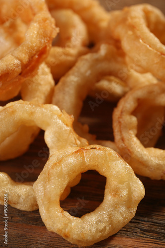 Chips rings on wooden background closeup