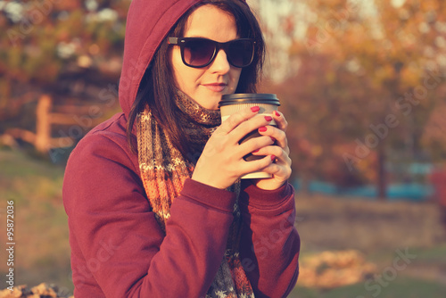woman enjoying coffee in park