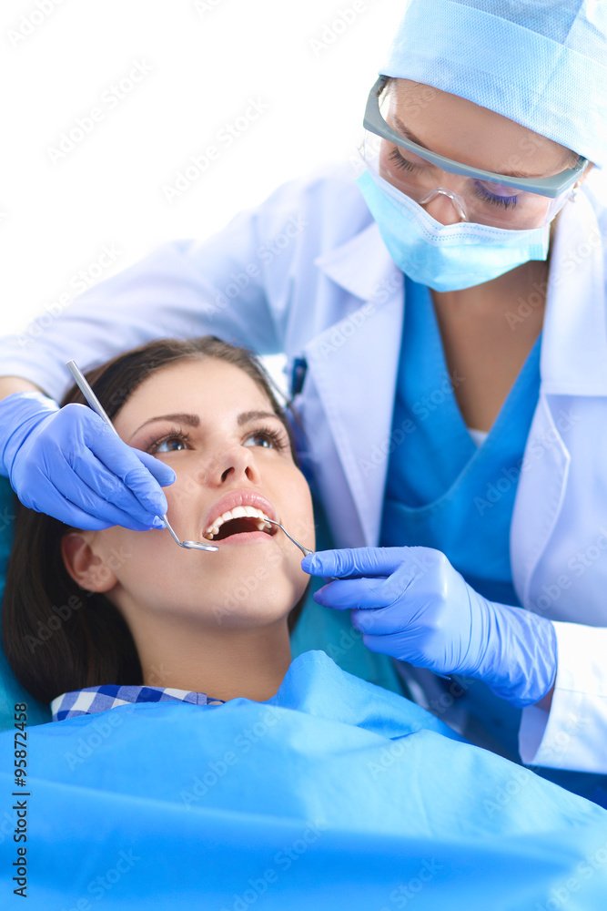 Woman dentist working at her patients teeth Woman dentist working at her patients teeth