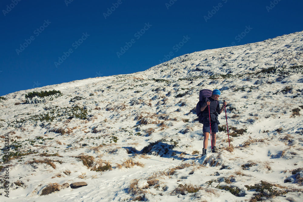 Fototapeta premium The girl with the backpack.