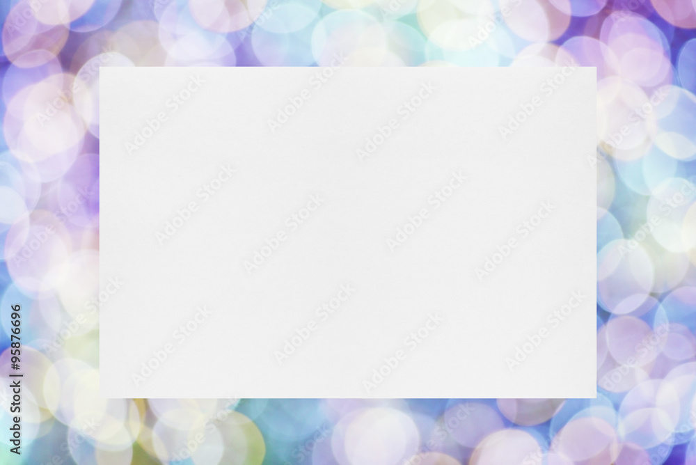 Paper sheet on festive lights background Paper sheet on festive lights background