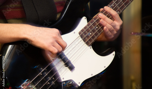 aggressive play guitar on stage