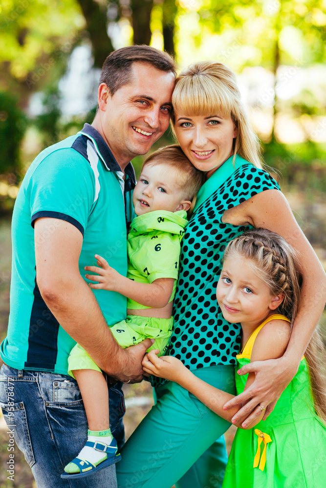 Fototapeta premium Happy family in the park. Happiness.