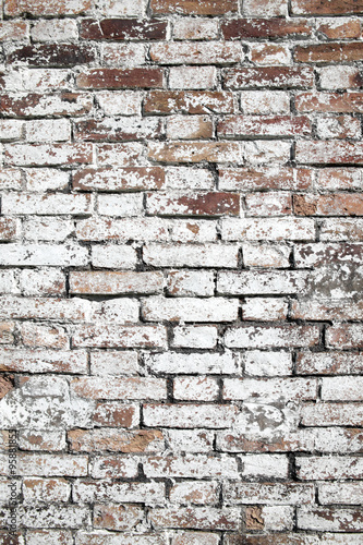 Old large red brick wall background distressed with white paint