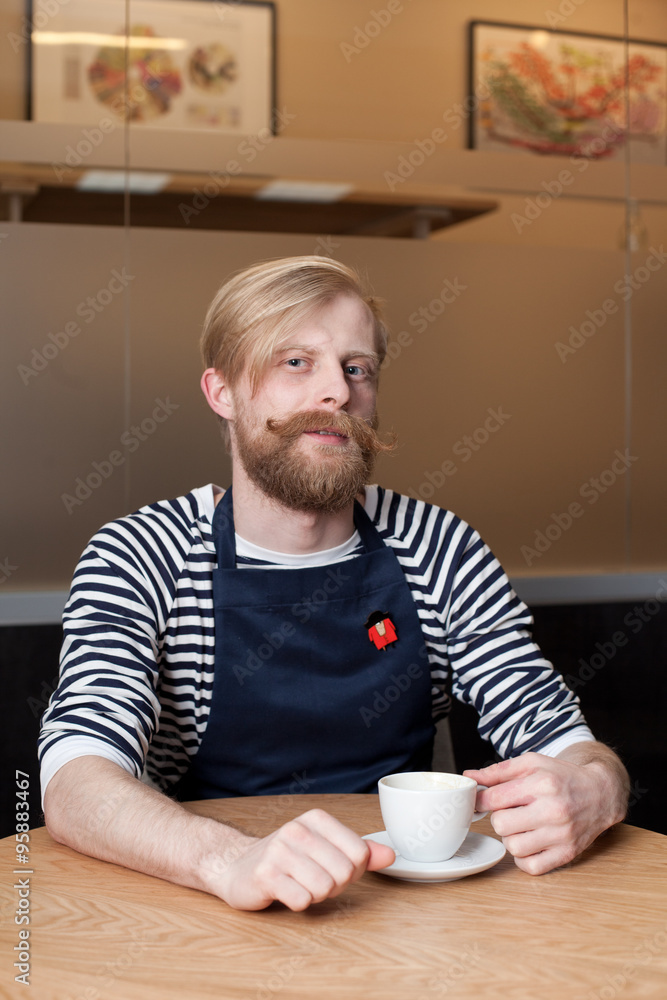 Handsome bearded man in cafe Handsome bearded man in cafe