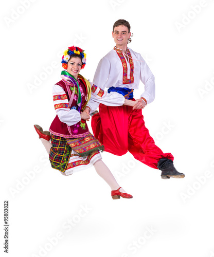 beautiful dancing couple in ukrainian polish national traditional costume clothes jumping, full length portrait isolated