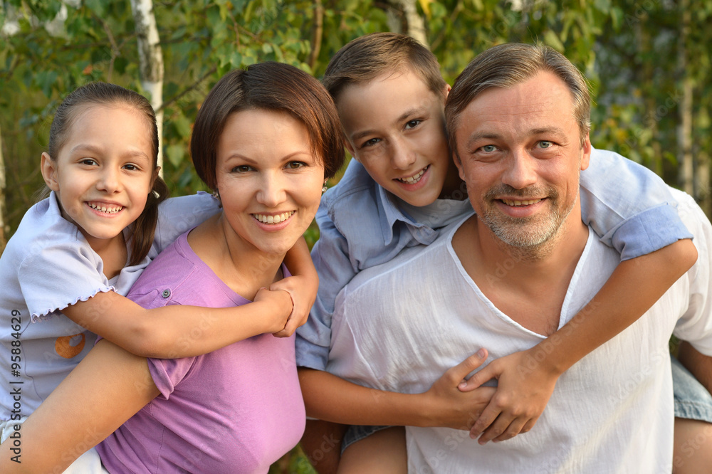 Family resting in  summer park