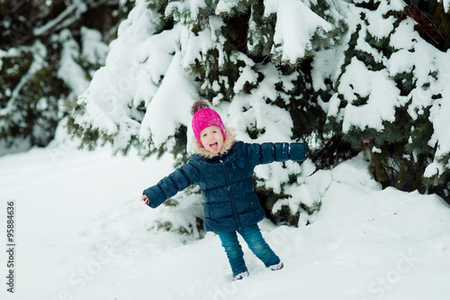 little girl having fun in the snow