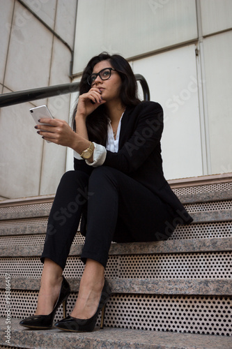 Businesswoman. / Business woman posing in a photo shoot with a tablet after work.  © pablobenii