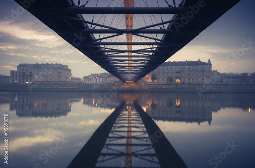 Bernatka footbridge over Vistula river in Krakow early morning #95891078