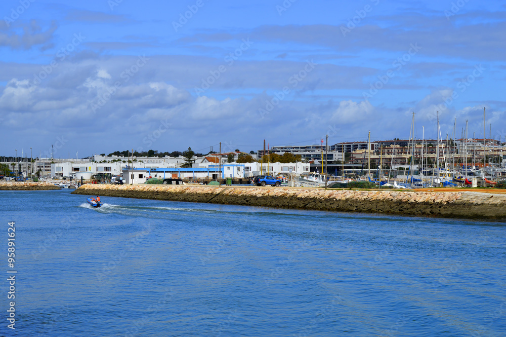 Lagos, Algarve, Portugal - October 28, 2015: Boats on the Bensafrim river in Lagos harbour