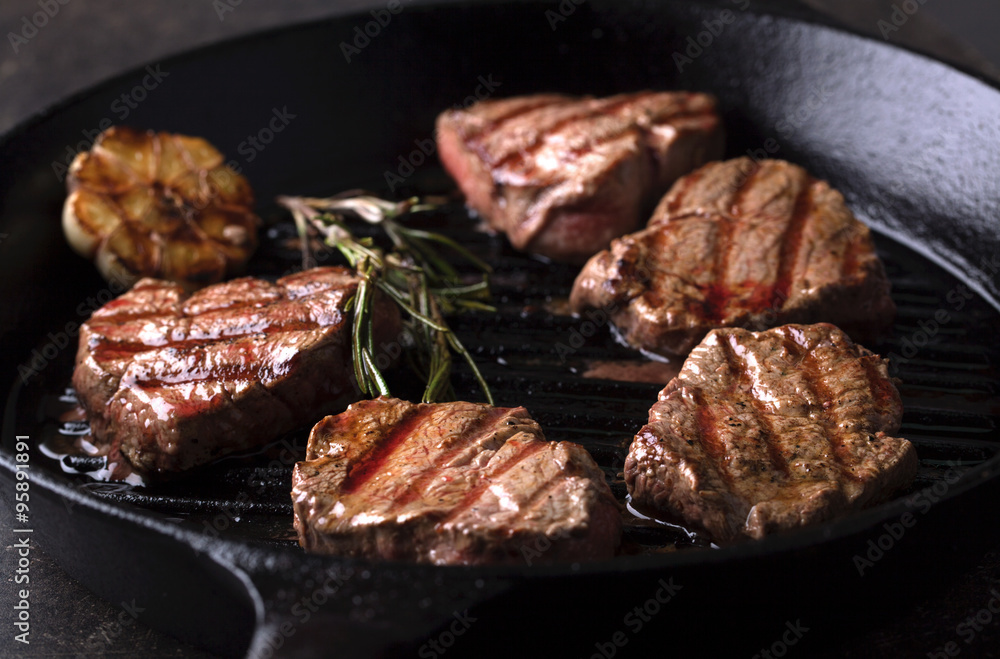 Grilled beef medallions on the grill pan