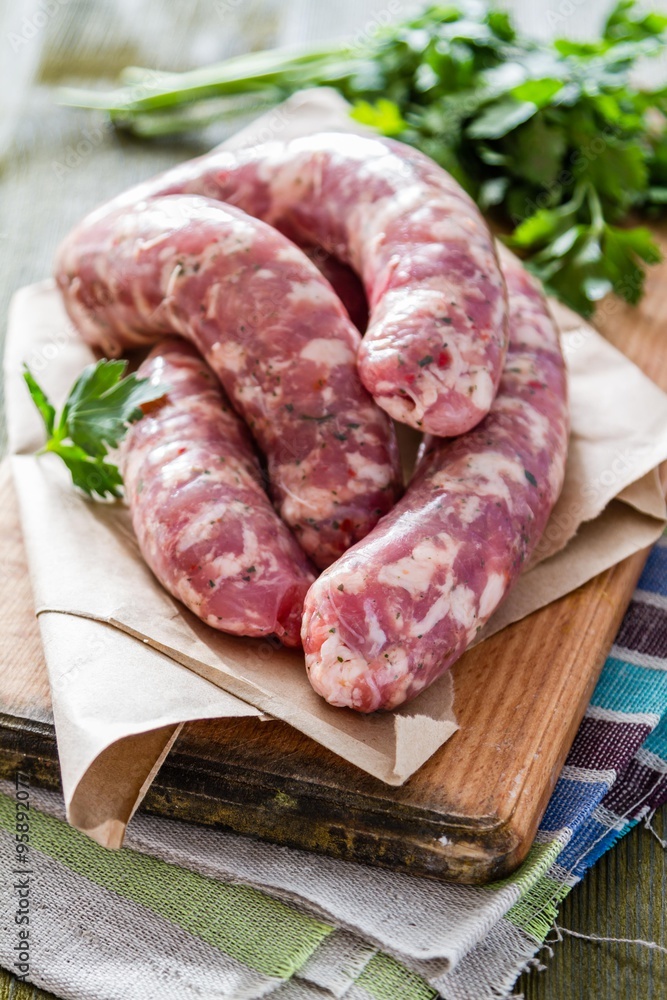 Raw sausages  with herbs and spices