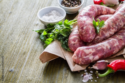 Raw sausages with herbs and spices
