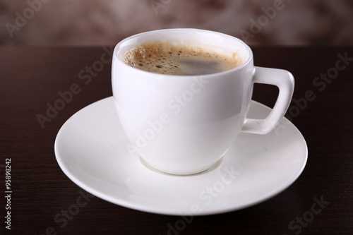 Cup of coffee on table close up