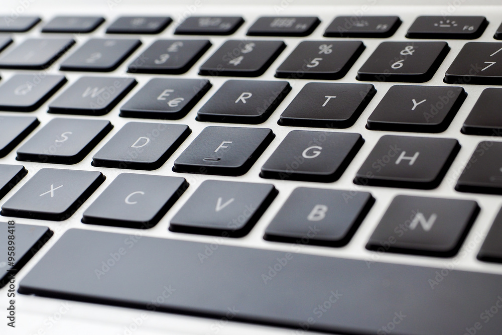 Computer keyboard keys close up, blurred in the corners