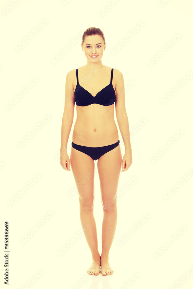 Fototapeta premium Happy woman standing in bikini.
