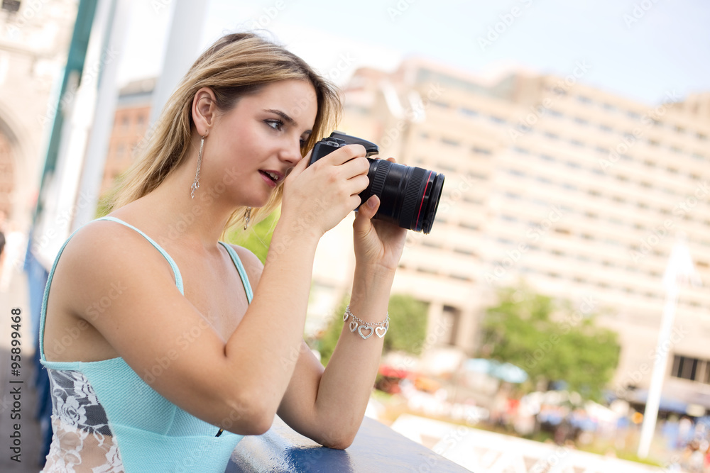 young woman taking a photo