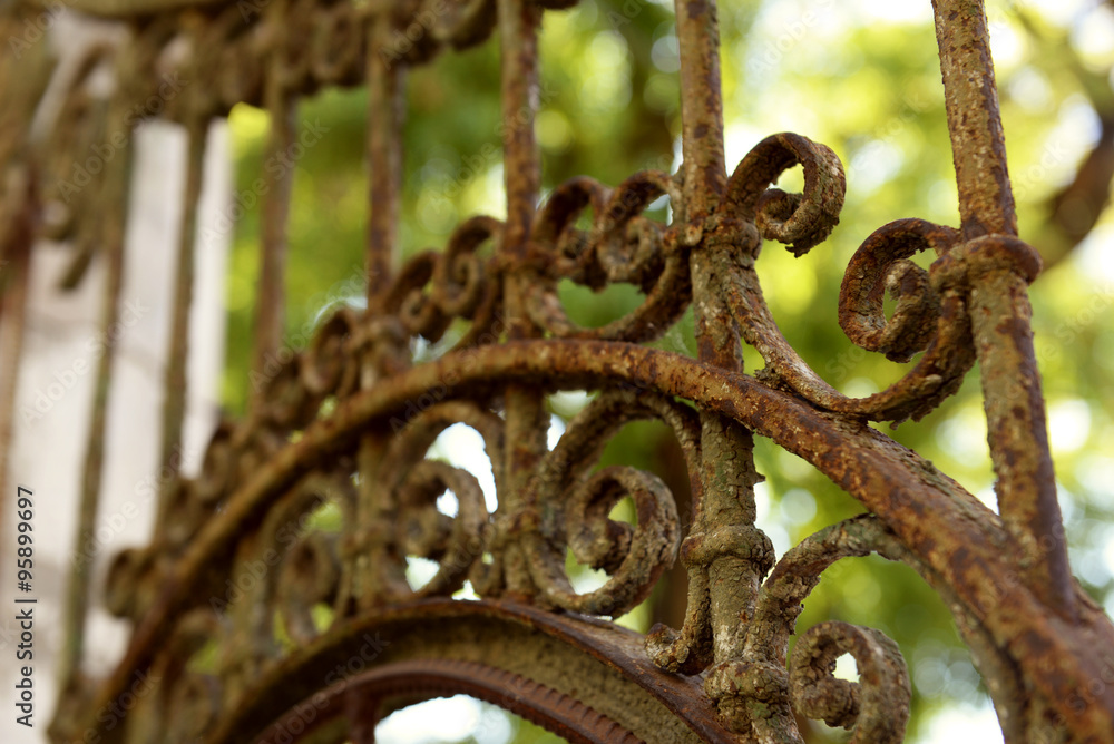 Old rusty forged fence, close up Old rusty forged fence, close up