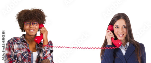 two girls talking on the phone
