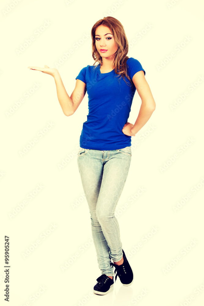 Young woman presenting a product. Young woman presenting a product.