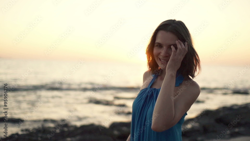 Portrait of pretty, happy woman during sunset on beach, super slow motion 240fps
Portrait of pretty, happy woman during sunset on beach, super slow motion 240fps
