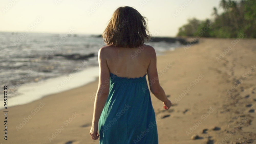 Young woman walking on beach, super slow motion 240fps
Young woman walking on beach, super slow motion 240fps