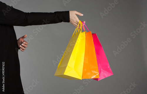 Holding shopping bags