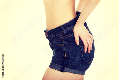 Sexy woman in jeans shorts.  © Piotr Marcinski