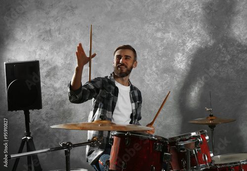 Musician playing the drums in a studio photo