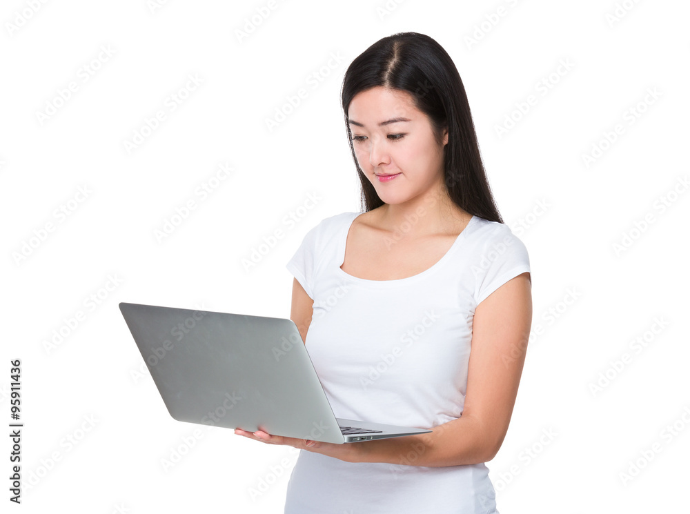 Asian Woman use of the laptop computer Asian Woman use of the laptop computer