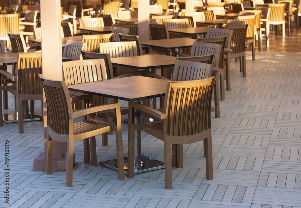 Wooden tables in a outdoor restaurant photo