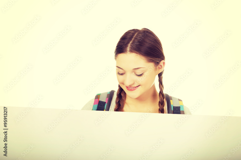 Young woman with blank billboard. Young woman with blank billboard.
