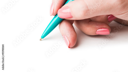 Close up of women hand writing with metallic pen.