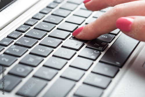 Close-up of typing female hands on keyboard