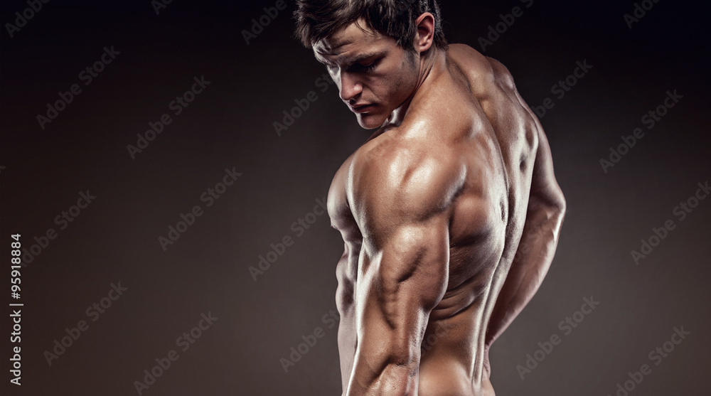 Strong Athletic Man Fitness Model posing back muscles and tricep