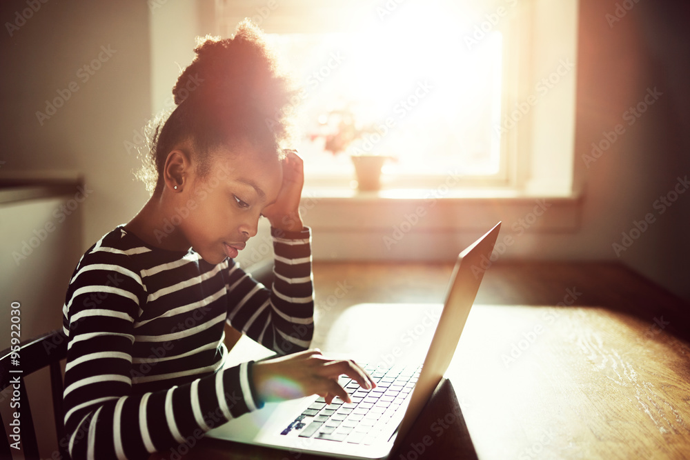 young black girl working on her homework young black girl working on her homework