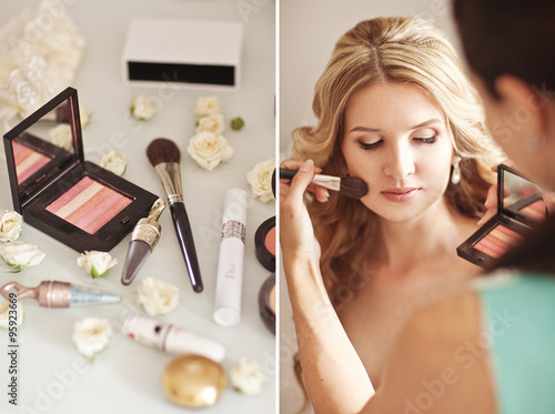 Obraz na płótnie Beautiful bride applying wedding make-up by professional make-up artist on the wedding day at home w salonie
