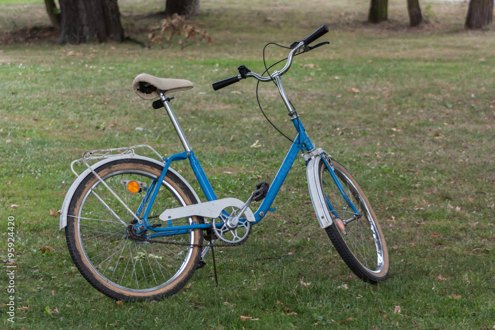 Charming blue and white Polish city bike made in 1992. The eco-friendly lifestyle.