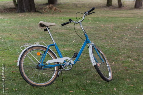 Charming blue and white Polish city bike made in 1992. The eco-friendly lifestyle.