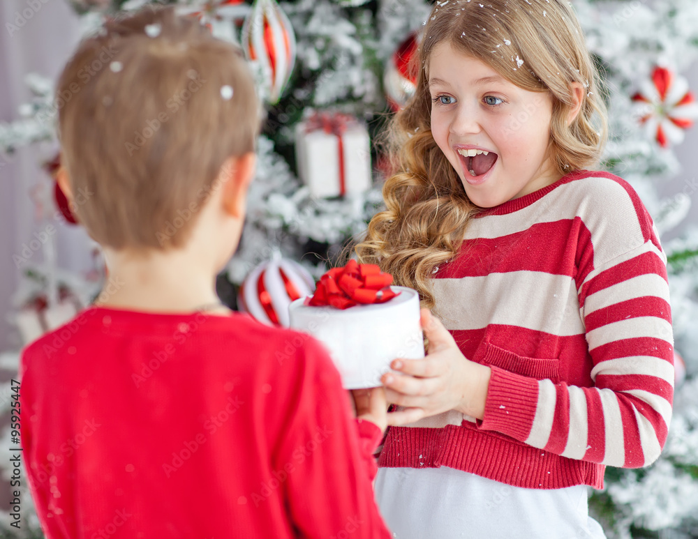 kids near the christmas tree