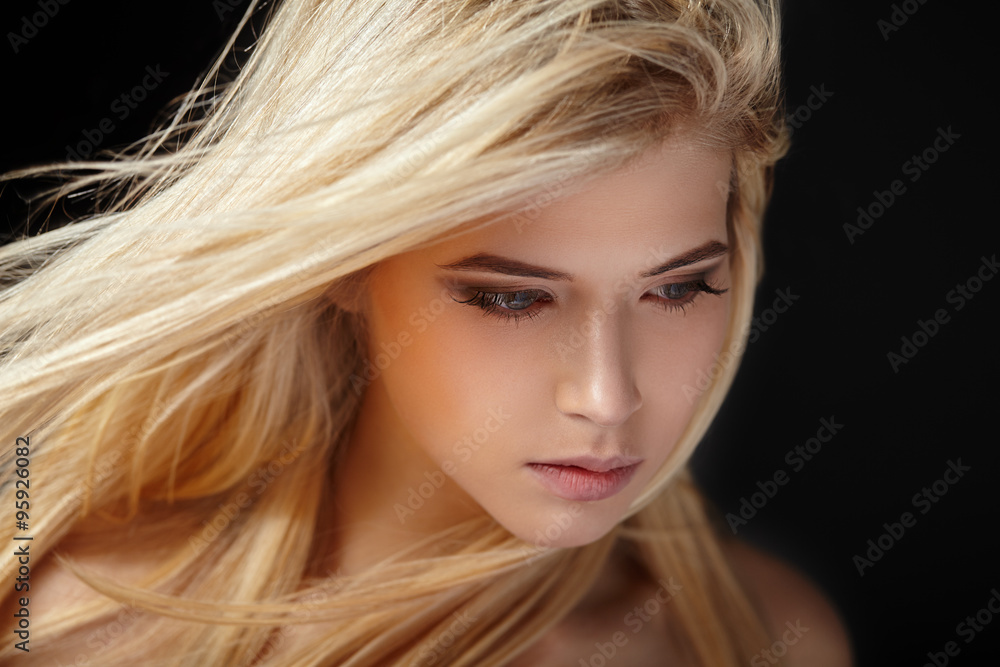 Beautiful young blonde girl with flowing hair. Beautiful young blonde girl with flowing hair.