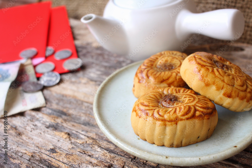 Red envelope with festival moon cake in chinese new year festival Red envelope with festival moon cake in chinese new year festival