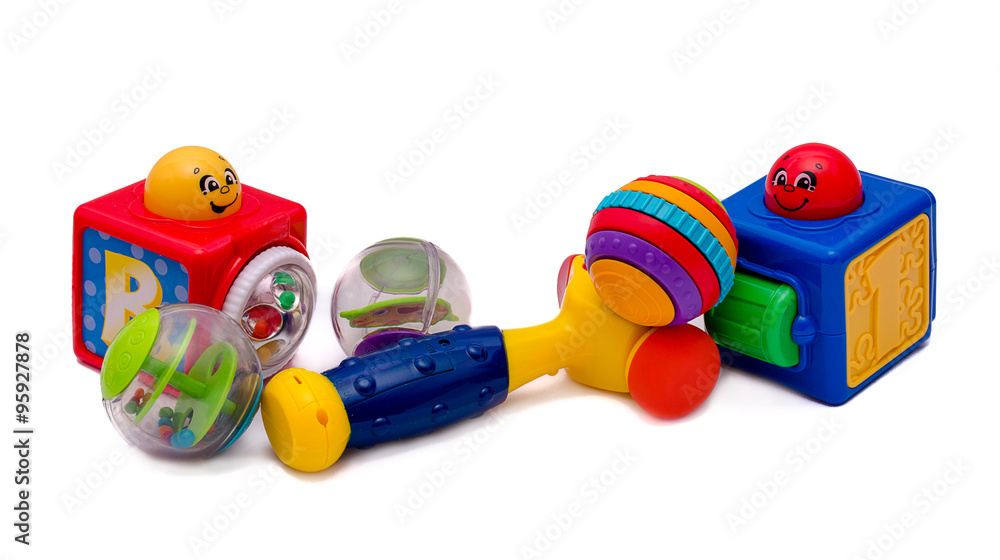 Group of toys, small balls, cubes, hammer isolated on white background