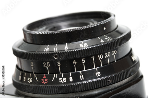 Closeup of old film camera lens.
