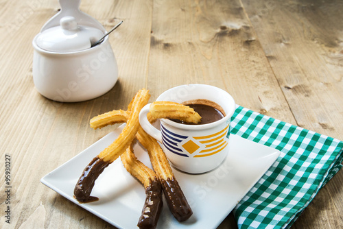 Churros with hot chocolate and sugar