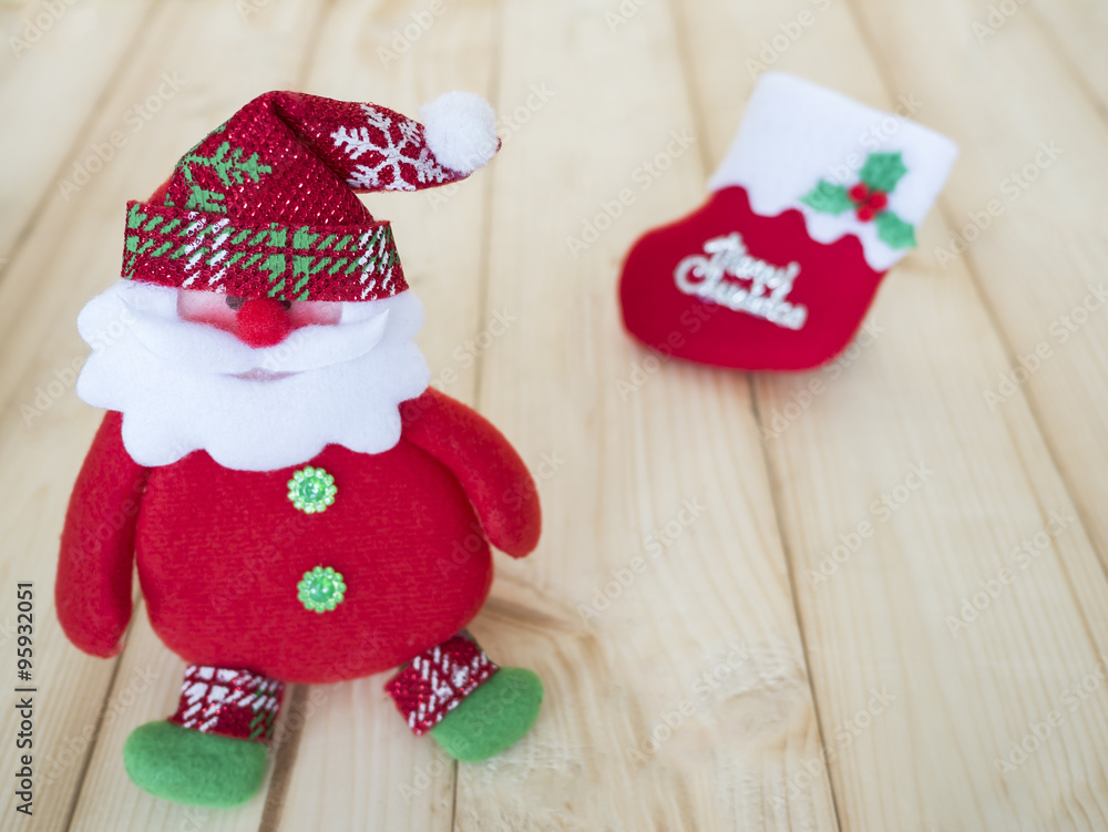 Christmas Holiday 3 - Santa and christmas sock decoration for Christmas Holiday on wood background