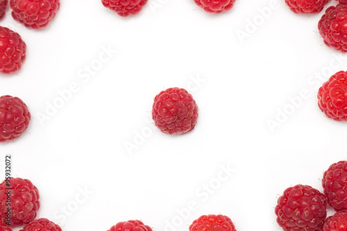 ripe raspberries on a white background