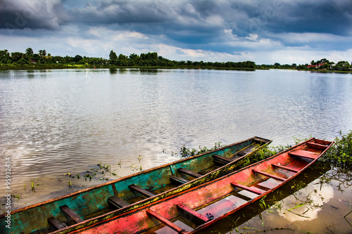 Fototapeta Naklejka Na Ścianę i Meble -  two long boat in a lake, HDR toned